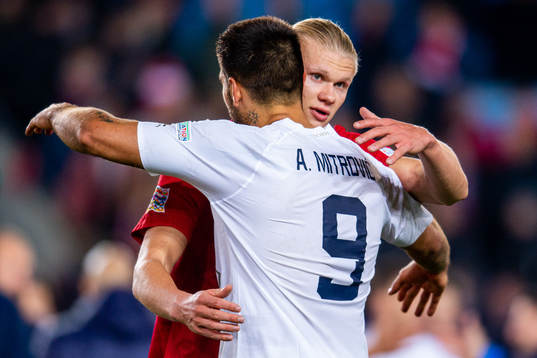 Erling Braut Haaland of Norway and Aleksandar Mitrovic of