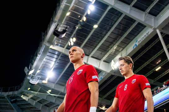 Leo Skiri Østigård and Sander Berge of Norway enter the