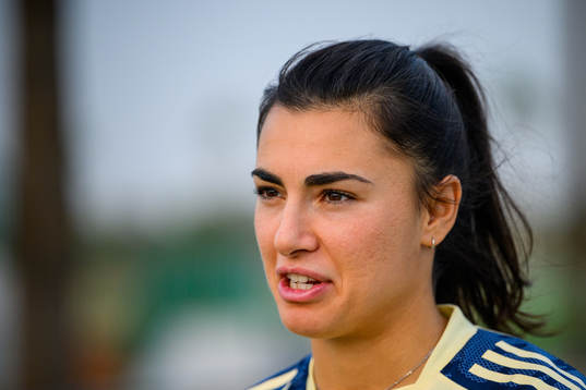 Goalkeeper Zecira Musovic is interviewed by the media