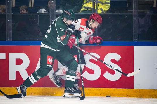 August Tornberg of Färjestad and Damian Kapica of Comarch