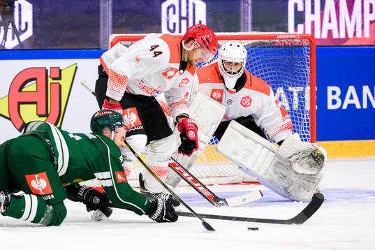 Henrik Björklund of Färjestad and Patrik Husak and