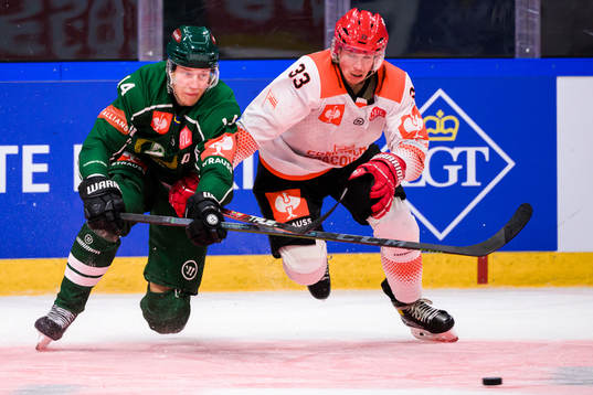 Victor Ejdsell of Färjestad and Jakub Saur of Cracovia