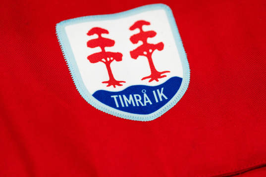Emblem på en Timtåtröja