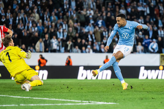 Martin Olsson of Malmö FF and goalkeeper Frederik Rönnow