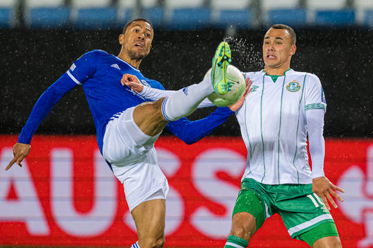 Mathis Bolly of Molde and Graham Burke of Shamrock Rovers
