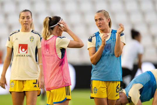 Kosovare Asllani and Magdalena Eriksson of Sweden
