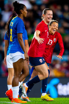 Celin Bizet Ildhusøy of Norway celebrates with teammate