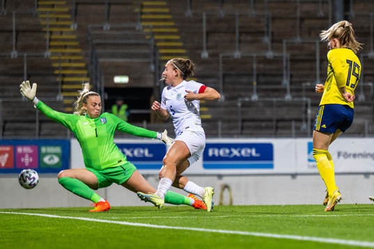 Matilda Vinberg of Sweden scores 1-1 behind goalkeeper