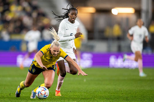Stina Blackstenius of Sweden  and Aissatou Tounkara of