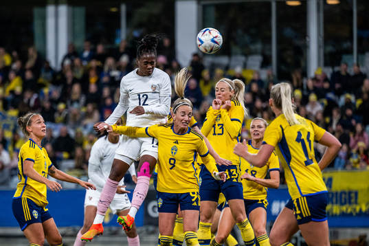 Melvine Malard of France competes with Kosovare Asllani and