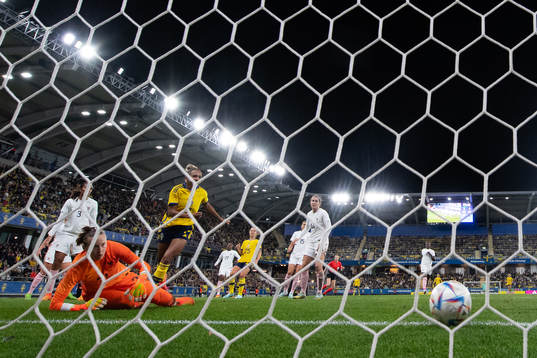 Madelen Janogy of Sweden scores 3-0 behind goalkeeper