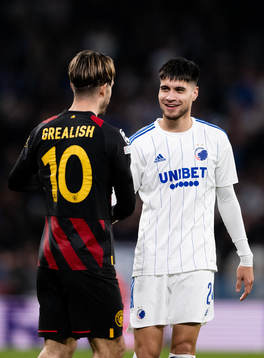 Jack Grealish of Man City and Kevin Diks of Copenhagen