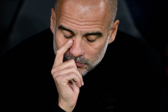 Head coach Pep Guardiola of Man City looks dejected