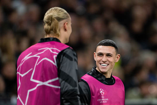 Erling Braut Haaland and Phil Foden of Man City