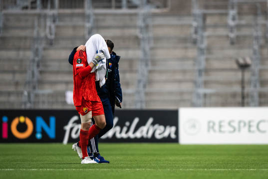 goalkeeper Aleksandr Vasiutin of Djurgården in pain