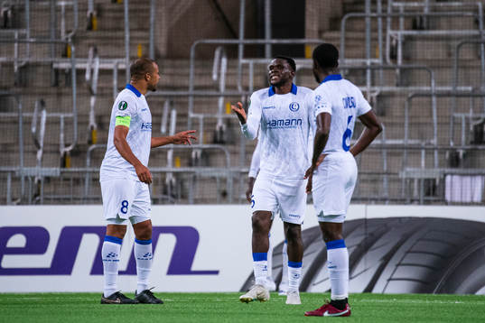 Vadis Odjidja-Ofoe and Michael Ngadeu of Gent react