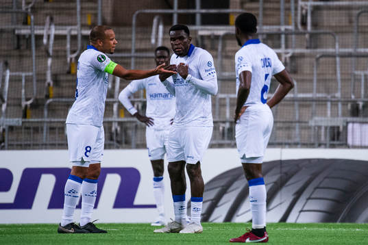 Vadis Odjidja-Ofoe and Michael Ngadeu of Gent react