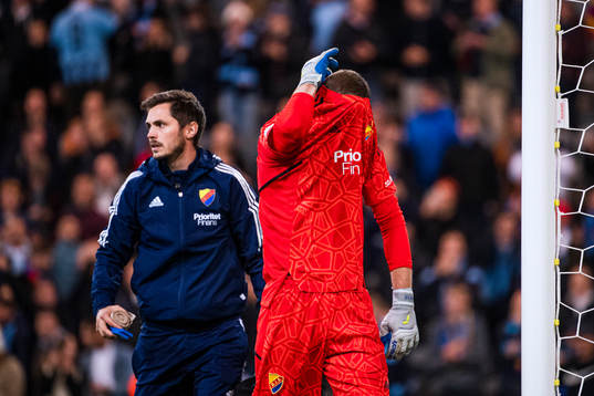 Goalkeeper Aleksandr Vasiutin of Djurgården in pain