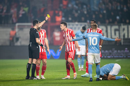 Janik Haberer of Union Berlin receives a yellow card
