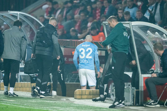 Jo Inge Berget of Malmö FF leaves the pitch due to injury