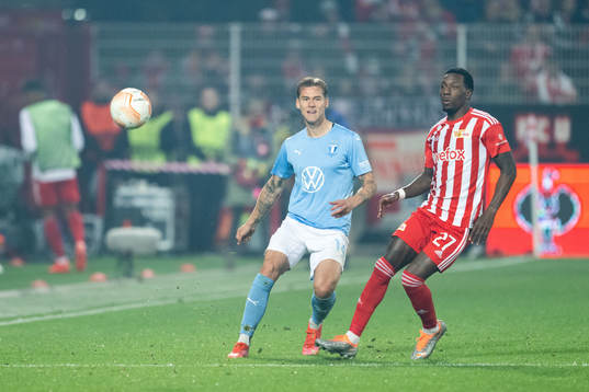 Felix Beijmo of Malmö FF and Sheraldo Becker of Union