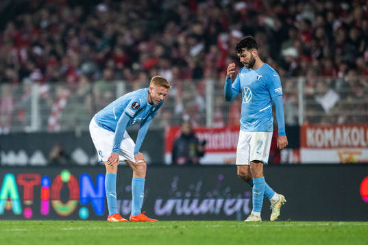 Hugo Larsson and Erdal Rakip of Malmö FF look dejected