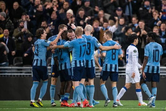 Players of Djurgården celebrate with Emmanuel Justine