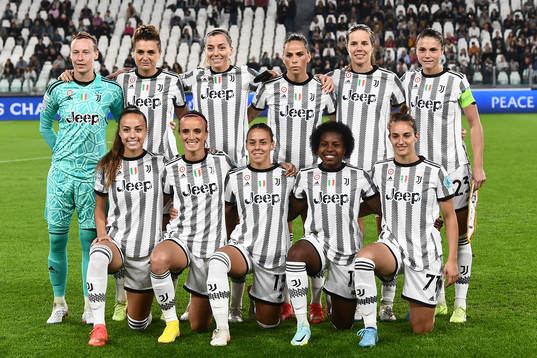 Players of Juventus pose for a photo