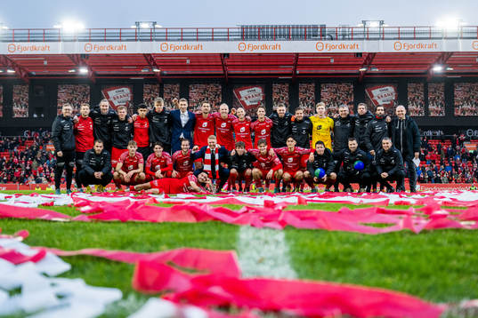 Players and staff of Brann celebrate