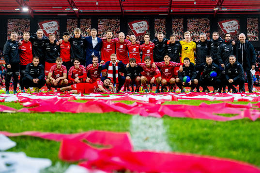 Players and staff of Brann celebrate