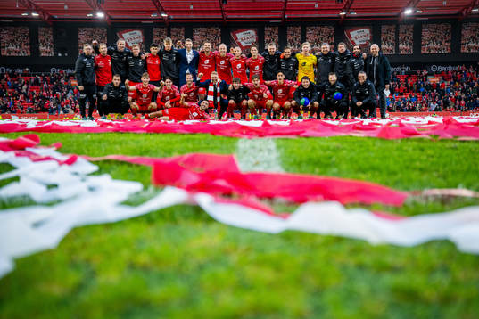 Players and staff of Brann celebrate