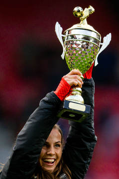 Tuva Hansen of Brann celebrates with the trophy at half-time