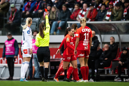 Referee Henrikke Holm Nervik shows a red card