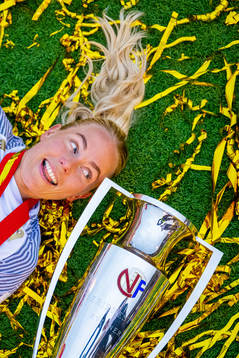 Guro Bergsvand of Brann celebrates with the trophy
