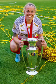 Therese Sessy Åsland of Brann celebrates with the trophy