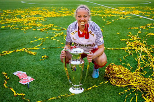 Therese Sessy Åsland of Brann celebrates with the trophy