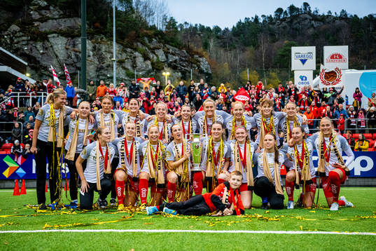 Players of Brann celebrate with the trophy