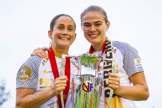 Ingrid Ryland and Marthine Østenstad of Brann celebrate