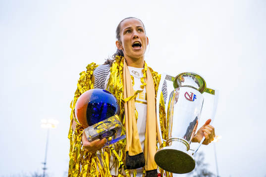 Tuva Hansen of Brann celebrates with the trophy and the