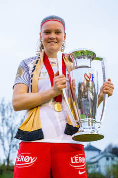 Signe Gaupset of Brann celebrates with the trophy