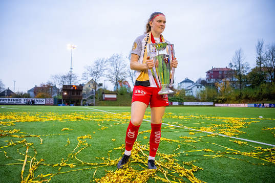 Signe Gaupset of Brann celebrates with the trophy