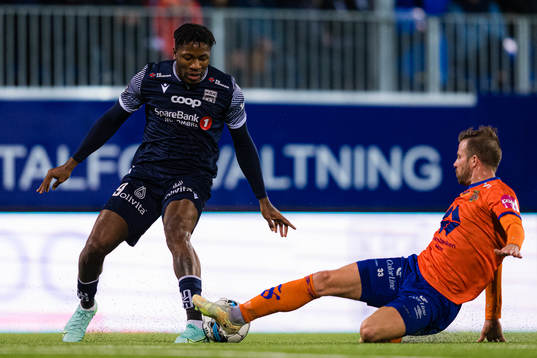 Pemi Moumbagna Faris of Kristiansund and Simen Rafn of