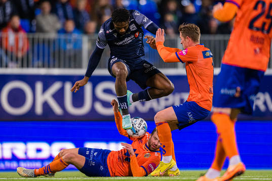 Pemi Moumbagna Faris of Kristiansund and Simen Rafn of