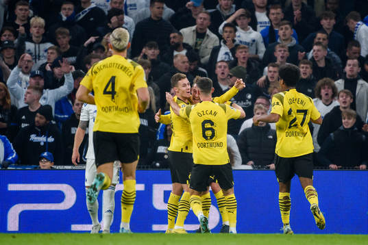 Thorgan Hazard of Dortmund celebrates with teammates