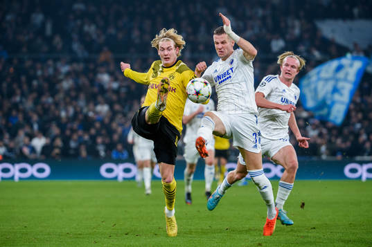 Julian Brandt of Dortmund and Denis Vavro of FC Copenhagen