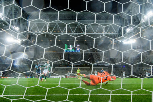goalkeeper Leon Pohls of Shamrock Rovers saves a shot from
