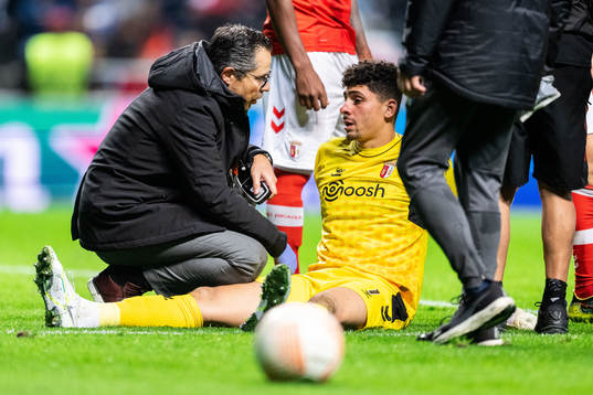 Goalkeeper Matheus of Braga receives medical attention
