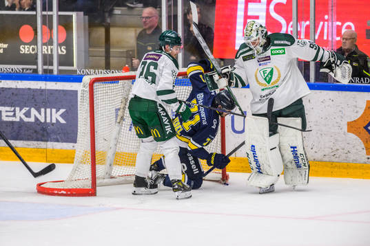 Färjestads målvakt Matthew Tomkins  och HV71s Tyler Vesel