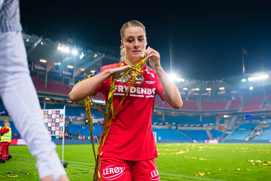 Svava Ros Gudmundsdottir of Brann celebrates with the trophy