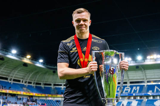 Eirik Haugan of Molde celebrates with the trophy